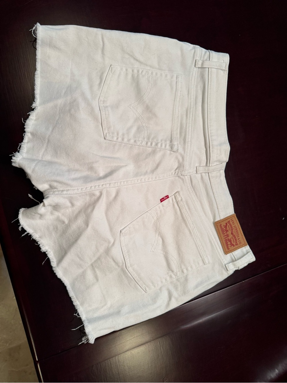 Levi's White Denim Cutoff Shorts with Frayed Hem